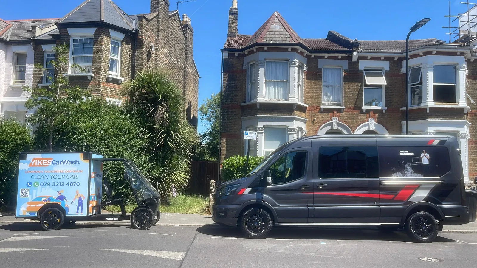 Yikes Car Wash cargo e-bike rig working on a Victorian terraced street in London